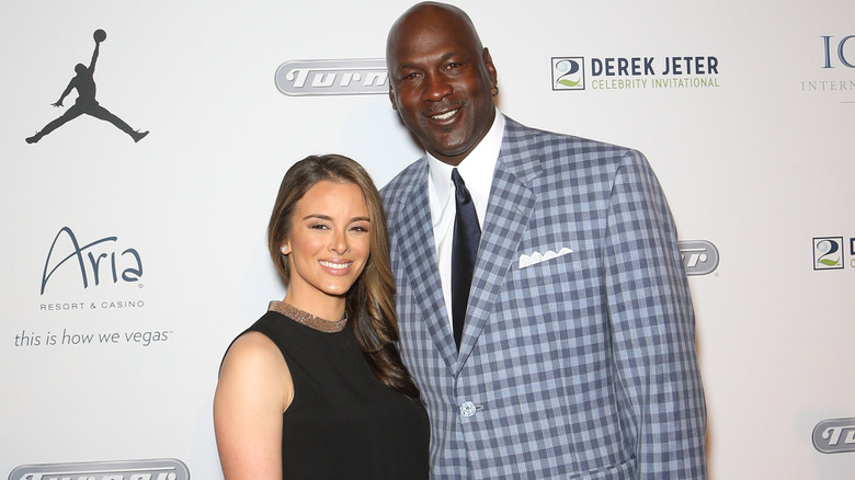 Yvette Prieto (L) and her husband, Charlotte Hornets owner and former National Basketball Association player Michael Jordan, arrive at the Derek Jeter Celebrity Invitational.