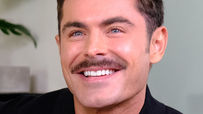 Zac Efron smiling mustache