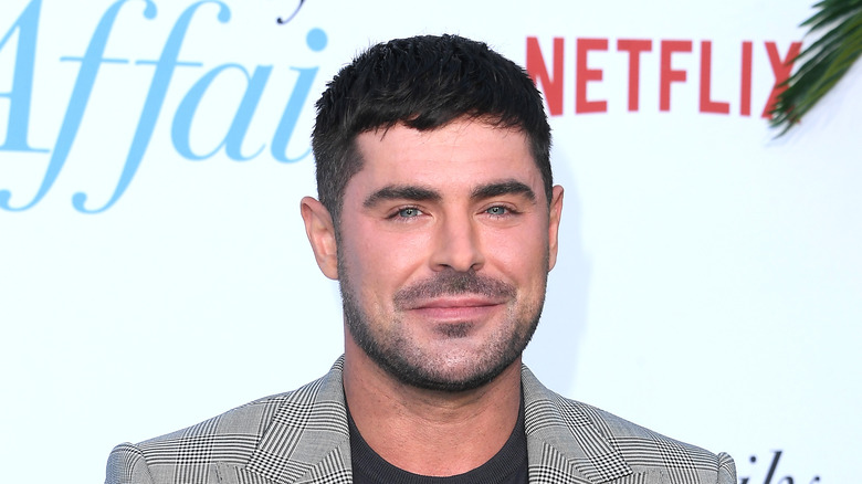 Zaf Efron plaid jacket black t-shirt