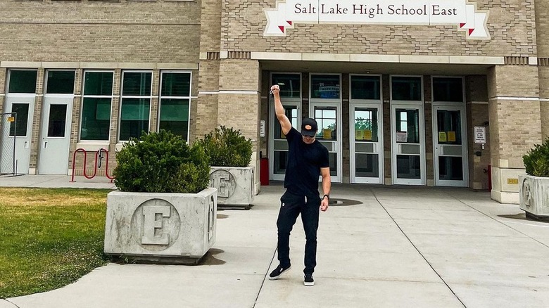 Zac Efron poses in front of East High