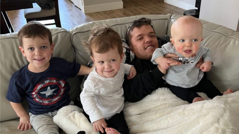 Zach Roloff on couch with kids