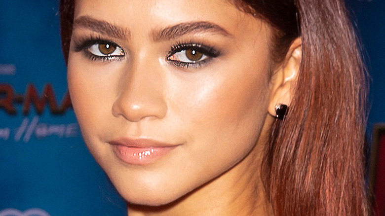 Zendaya smiles over her shoulder