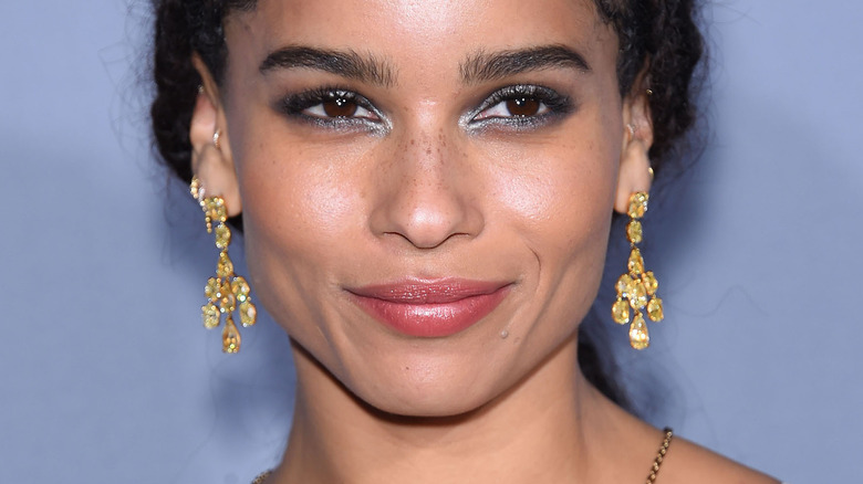 Zoë Kravitz with dangling gold earrings