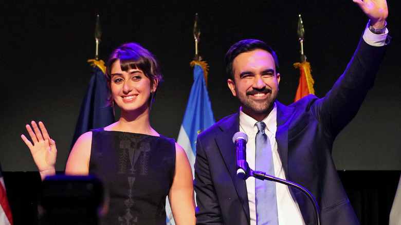 Zohran Mamdani and wife Rama Duwaji waving