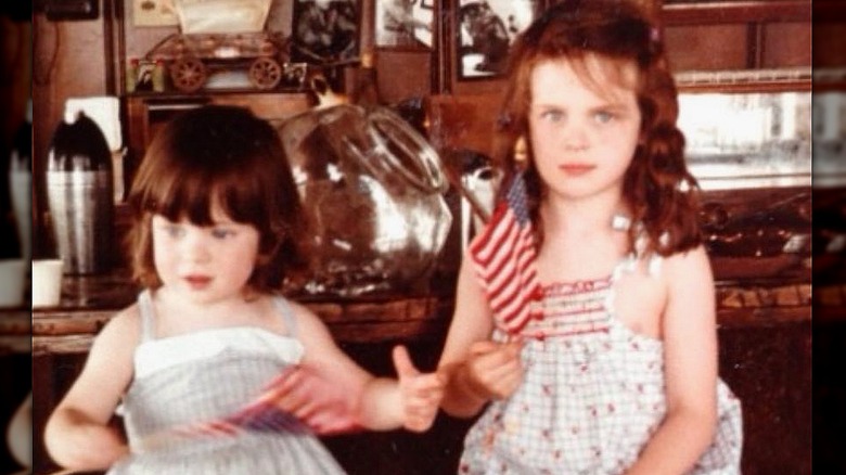 Zooey Emily Deschanel little kids holding flag