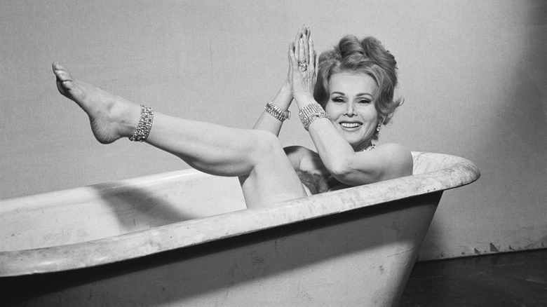 Zsa Zsa Gabor poses nude in a bathtub