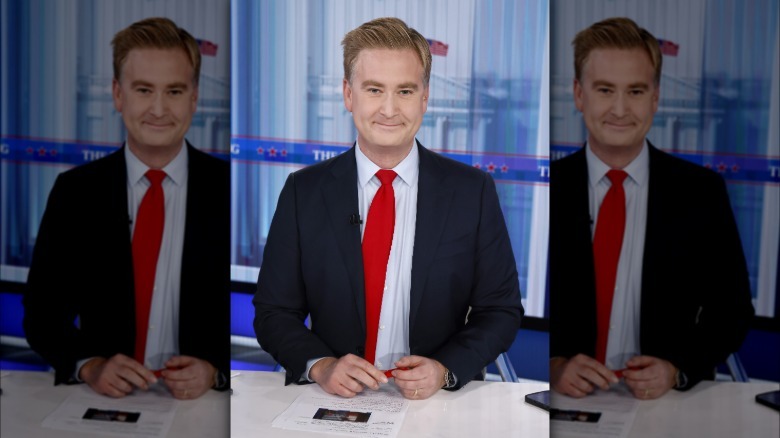 Peter Doocy sitting at a desk