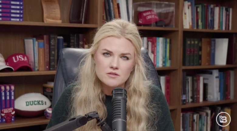 Erika Kirk speaks into mic while sitting in an office chair