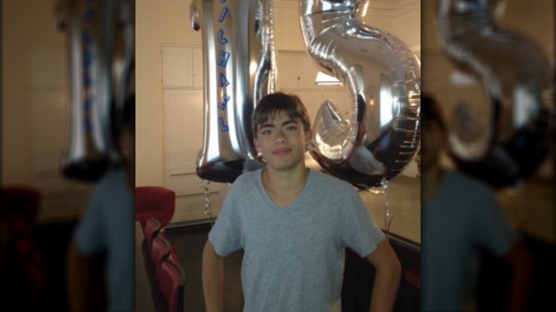 Michael Consuelos with mylar balloons