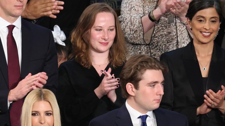Sierra Burns clapping behind Barron Trump during the State of the Union address