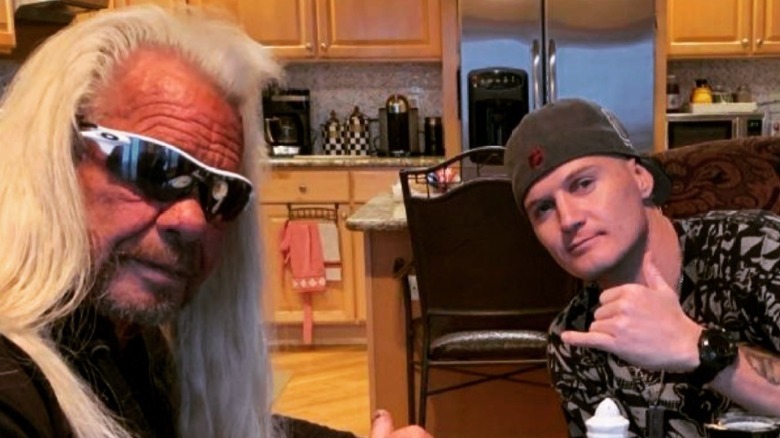 Dog the Bounty Hunter and Justin Bihag sharing a meal together.