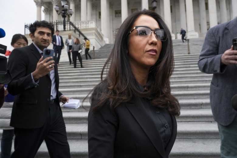Lauren Boebert walks outside the U.S. Capitol in black attire