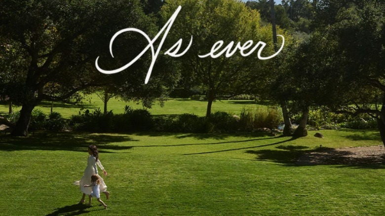 Meghan Markle and Princess Lilibet running on grass