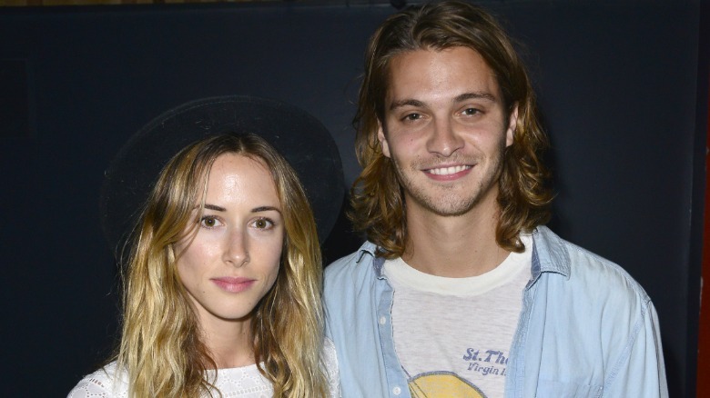 Luke Grimes and Gillian Zinser pose in 2013