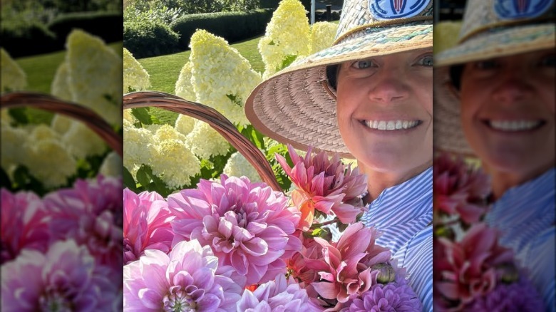 Norah O'Donnell posing with a basket of flowers.