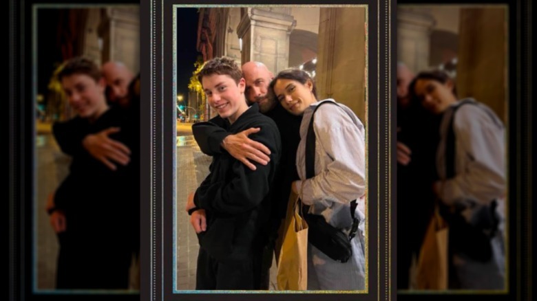 John Travolta posing with his two kids