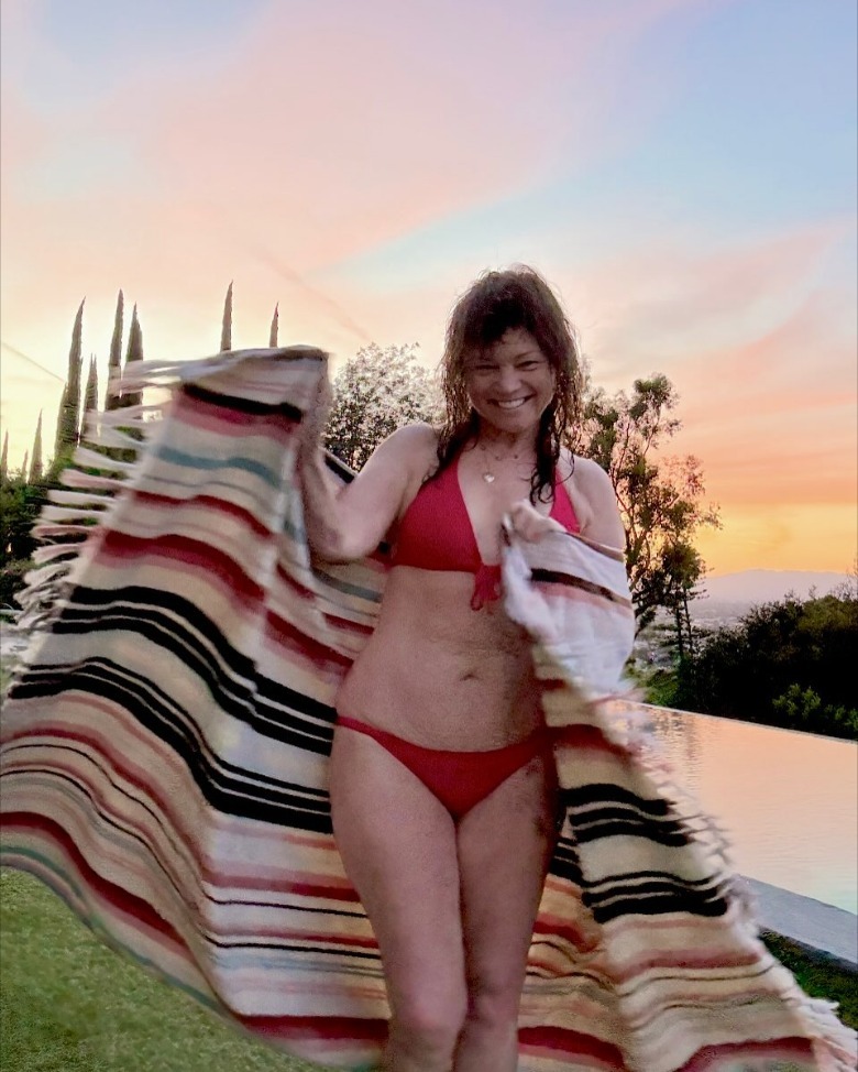 Valerie Bertinelli wearing bikini holding towel