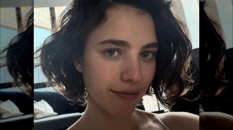 Margaret Qualley smiling with bob haircut