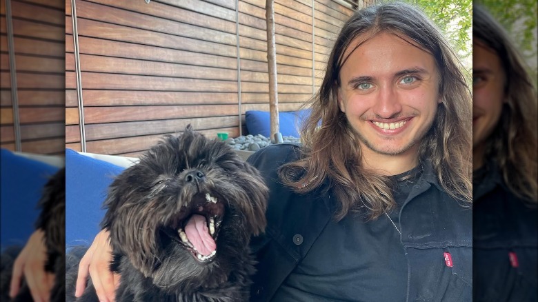 Sergio Ripa poses with a dog.