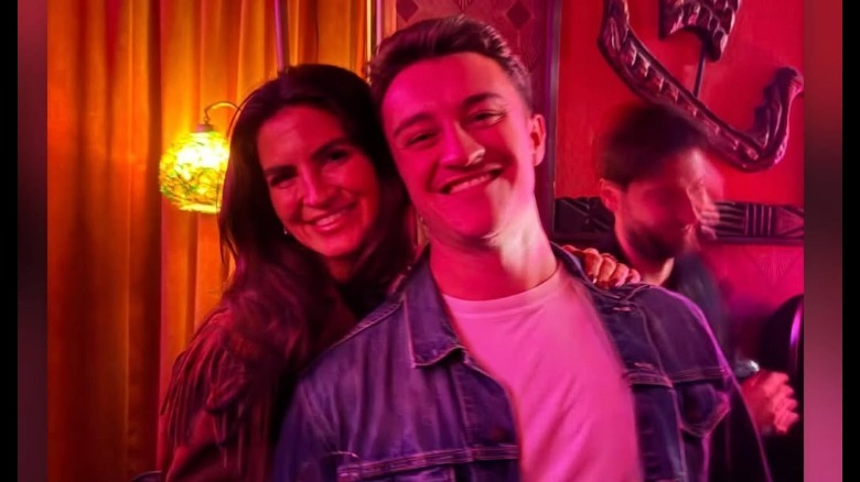 Kaitlan Collins in a red room with Sean Francis