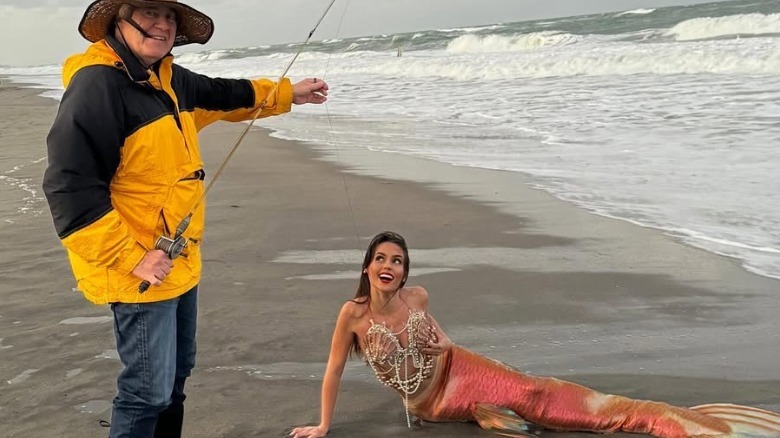 Bill Belichick catching Jordon Hudson in a mermaid costume