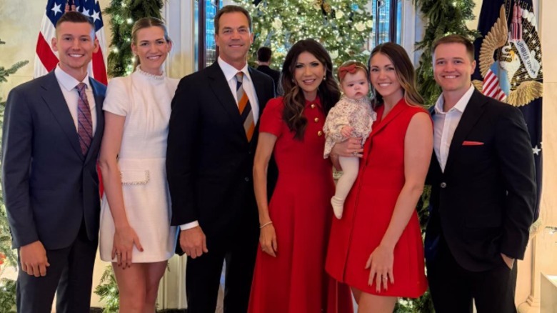 Kristi and Bryon Noem posing with their daughters and sons-in-law at the White House.