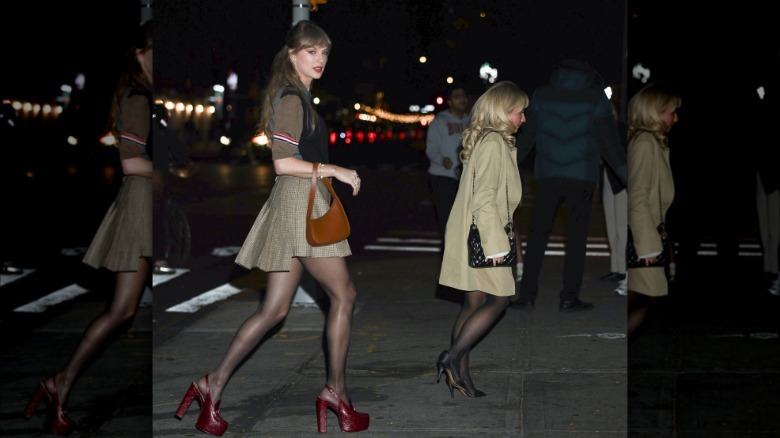Taylor Swift and Sabrina Carpenter walking across the street