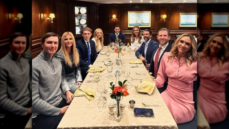 The Trump children and their spouses pose together at a restaurant.