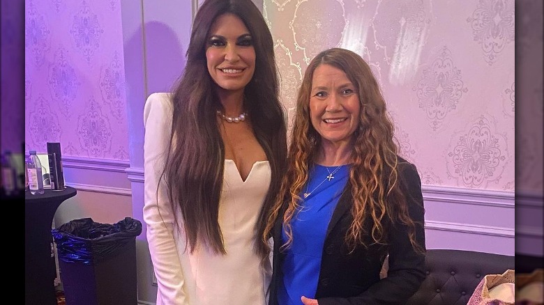 Kimberly Guilfoyle posing with Trump delegate