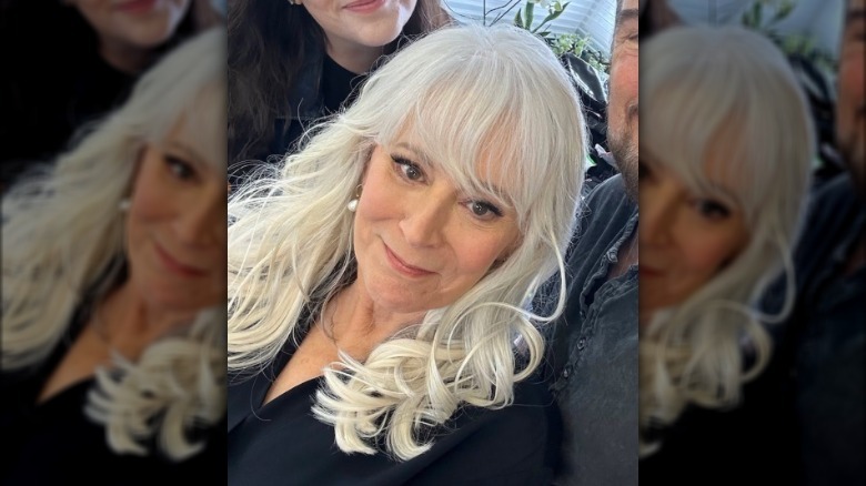 Patricia Richardson posing for a selfie behind-the-scenes of a photoshoot.