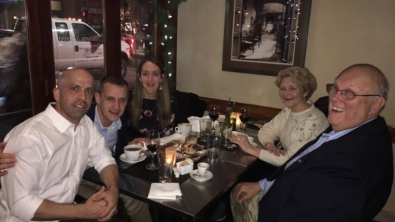 Corey and Alison Lewandowski pictured at a group dinner for their wedding anniversary in 2016.