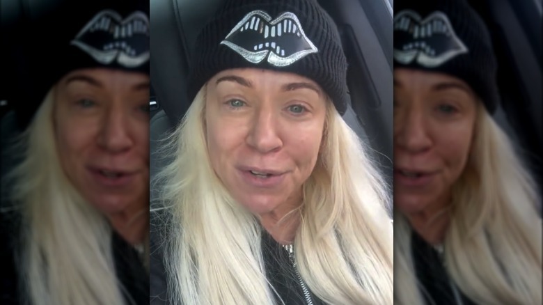 Theresa Caputo wearing a beanie in her car.