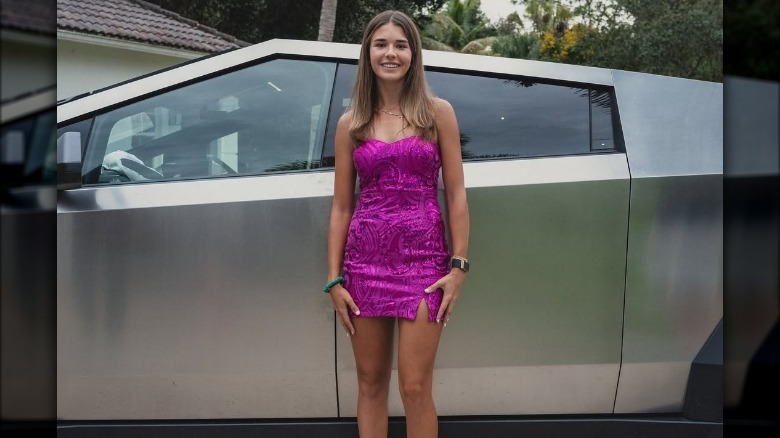 Kai Trump posing in front of Tesla Cybertruck