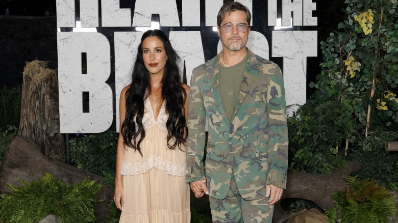 Brad Pitt in camo suit with Ines de Ramon