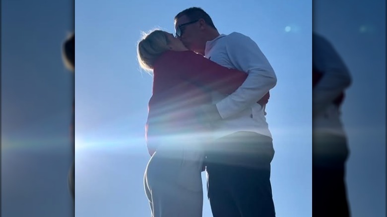 Karoline Leavitt and Nicholas Riccio kiss after getting engaged.