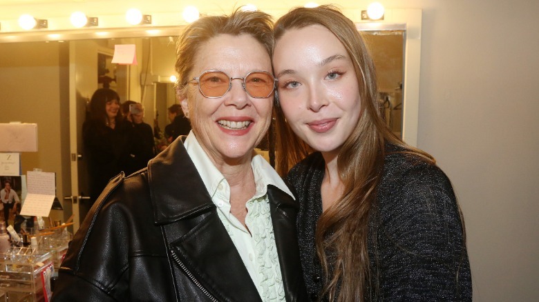 Annette Bening and Ella Bening posing in a dressing room.
