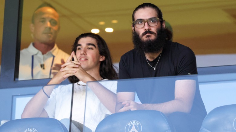 Eddy and Nelson Angelil at a football match in 2026.
