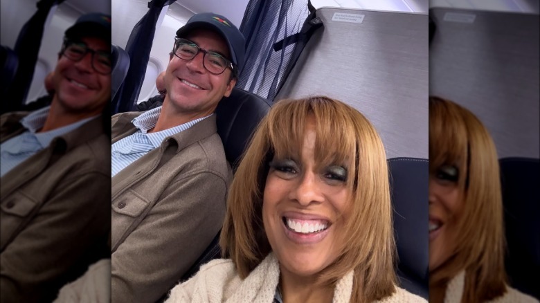 Gayle King and Jesse Watters taking a selfie together on a plane