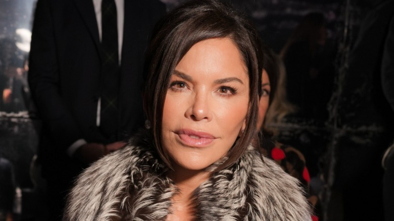 Lauren Sanchez Bezos at Fashion week in a fur-trimmed coat