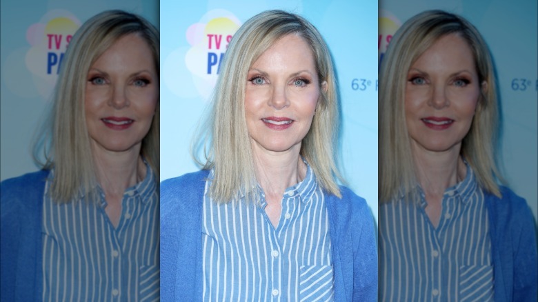 Melissa Sue Anderson wearing a blue cardigan and striped shirt.