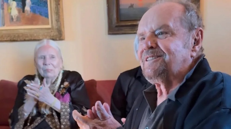 Jack Nicholson clapping and smiling