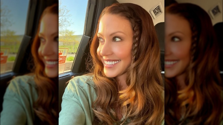 Shannon Elizabeth posing for a selfie in a car.